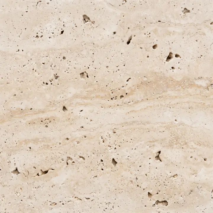 Placa de piedra natural en primer plano, con su veta y poro a la vista